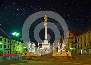 Nightscape of Maribor, Slovenia. Plague Column on Main Square