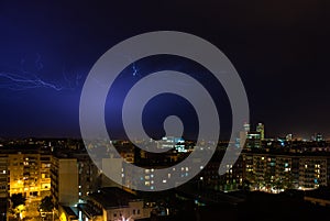 Nightshot of Barcelona skyline during an electrical storm photo