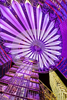 Nightshot of the vault of the Sony Center lit by purple light