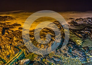 Nightshot of the waves and rocks at the indian ocean at the Wild Coast photo