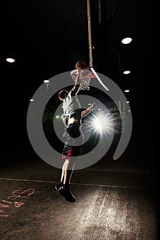 Nighttime basketball player