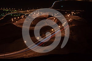 Nighttime long exposure of Viewpoint of twisted highway on Jebal Hafeet aka Jebel Hafit in Al Ain, UAE