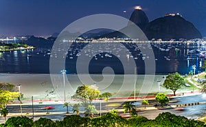 Nighttime View of Busy Bay Area with Iconic Hill Background