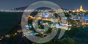 Nighttime view of Vico Equense with Vesuvius in background photo