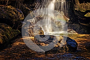 At the base of the falls.