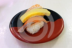 Nigiri sushi of ebi (shrimp or prawn), fish, and egg