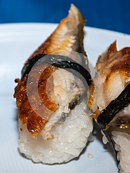 Nigirizushi with eel on a plate.