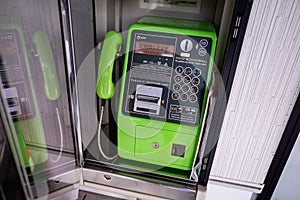 Close up of a typical japanese public phone booth with its familiar green phone at Itoigawa,