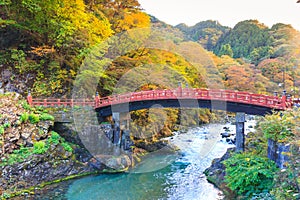 Nikko red Shinkyo bridge in autumn season.