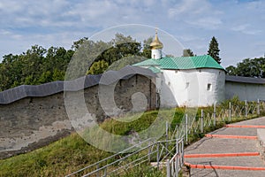 Nikolskaya tower with fortress wall of Holy Dormition Pskovo-Pechersky Monastery. Pechory, Russia