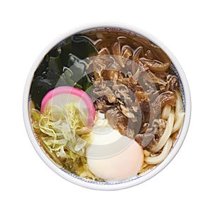 Niku Udon with Onsen tamago, Udon noodle soup with beef, isolated on white background with clipping path