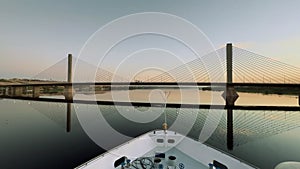 Nile Sunrise Serenity: Cruise Ship Under Bridge