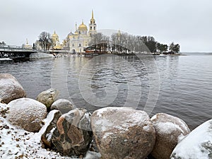 Nilo-Stolobenskaya Nilov hermitage-Orthodox monastery in winter on a cloudy day. Russia, Tver region