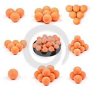 Nine Close up view of orange boilies, fishing baits for carp