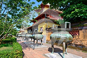 Urns in line in Imperial City Hue, in the Forbidden City of Hue. The Nine Dynastic Urns in line is one of the famous artworks. photo