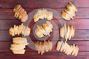 Nine loaves of bread sliced in staggered formation