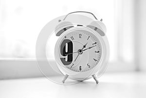Nine o`clock morning clock bokeh background