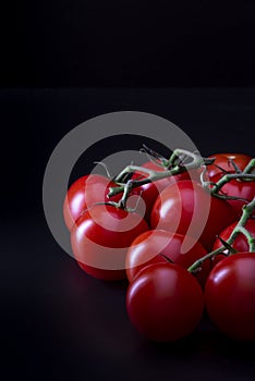 Nine red tomatoes in atmospheric light