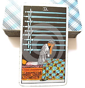 9 Nine of Swords Tarot Card Deep Unhappiness Joyless Mental Anguish Sick with Worry Anxiety Stress Worries Burdens photo