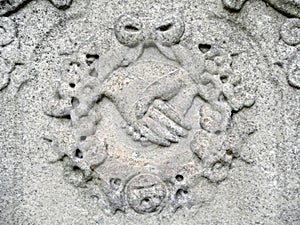 Nineteenth century tombstone detail clasped hands photo