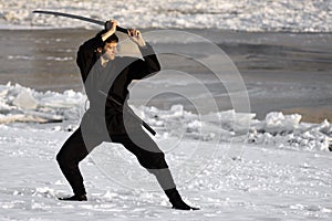 Ninja with sword at winter