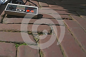 A nintendo controller laying on the found