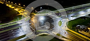 intersection at night from the drone wet road, road lighting photo