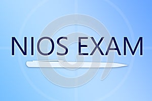 NIOS Exam showing with pen and blue colourful background. photo