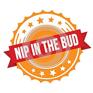 NIP IN THE BUD text on red orange ribbon stamp