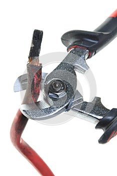 Nippers is cutting damaged red cable