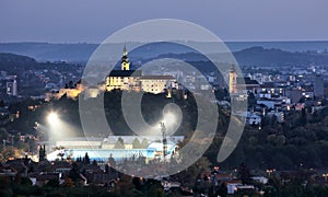 Nitra skyline at nigth with castle, church and football stadion