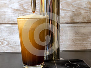 Nitro Cold Brew coffee in a clear glass