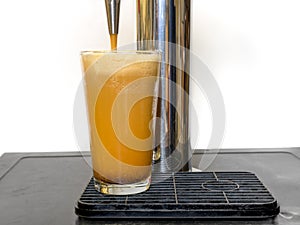 Nitro Cold Brew coffee pouring into a clear glass