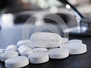 Nitroglycerin tablet pill used for angina pectoris photo