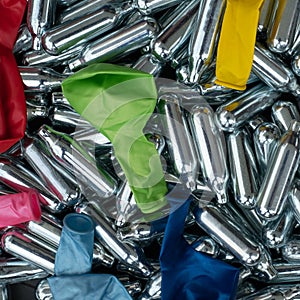 Nitrous oxide canisters / cream puff chargers and balloons: steel cylinders contain nitrous oxide / laughing gas for legal high