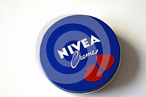 Nivea cream product and two red hearts white background