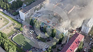 Nizhnevartovsk, Russia - July 1, 2019: firefighters extinguish a fire on the roof of a residential highrise building