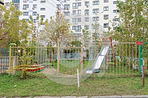 Nizhny Novgorod, Russia. - October 13.2016. Children& x27;s playground is fenced with a fence with a locked gate.