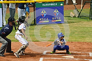 Nknown catcher about to catch a foul ball in a baseball game