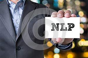 NLP letters (or Neuro Linguistic Programming) on the card shown