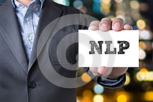 NLP letters (or Neuro Linguistic Programming) on the card shown photo