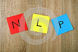 NLP - Neuro Linguistic Programming sign on sticky notes photo