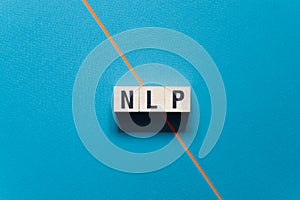 NLP - Neuro Linguistic Programming word concept on cubes