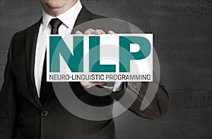 NLP sign is held by businessman photo