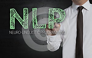 NLP is written by businessman on screen photo