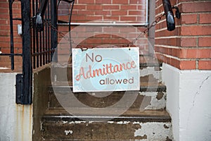 No admittance allowed sign hanging on chain in city