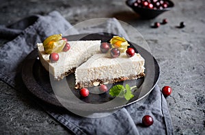 No bake yoghurt and coconut cake with almond, dried plums and chia seeds crust