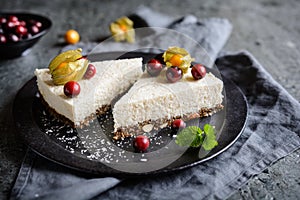 No bake yoghurt and coconut cake with almond, dried plums and chia seeds crust