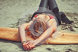 No better place for a timeout than the beach. a beautiful young woman going for a surf at the beach.