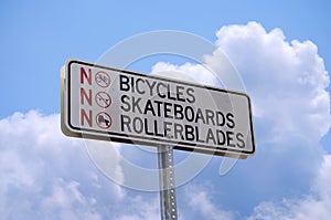 No bicycles skateboards or rollerblades sign